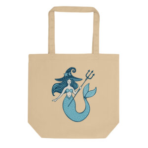 A whimsical witchy mermaid tote bag in a sandy beige color, featuring a blue mermaid wearing a starry witch hat and holding a trident.